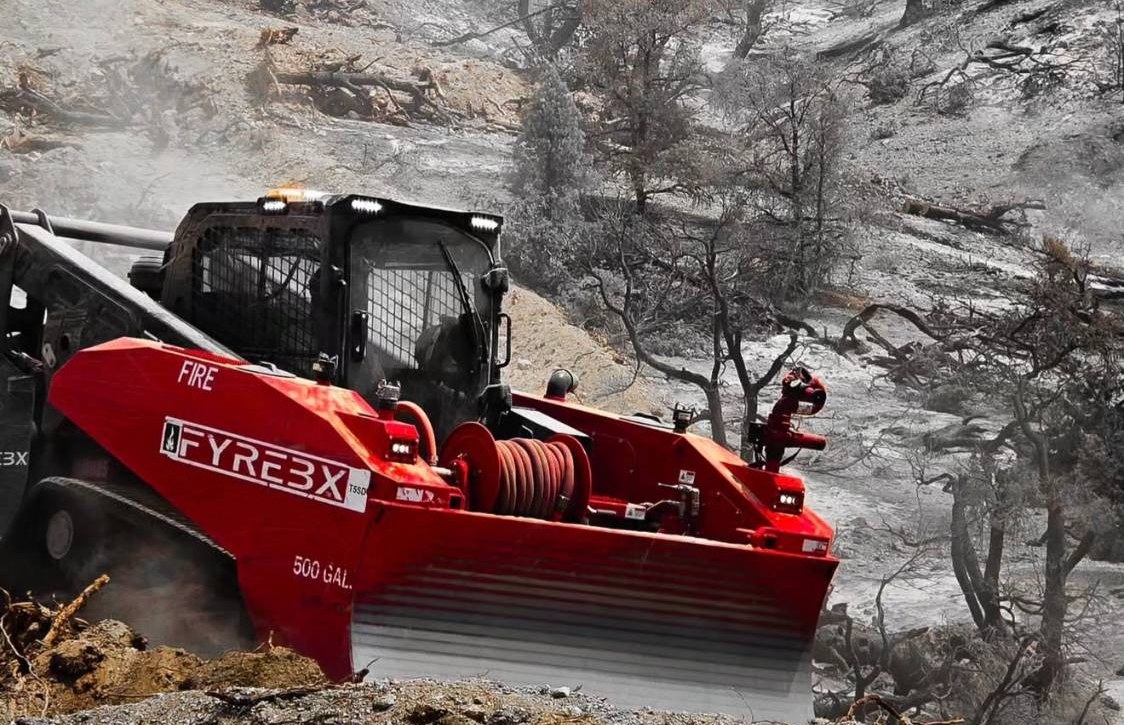 FyreCat front view with 500-gallon tank, hose reel and dozer blade on a burn scar